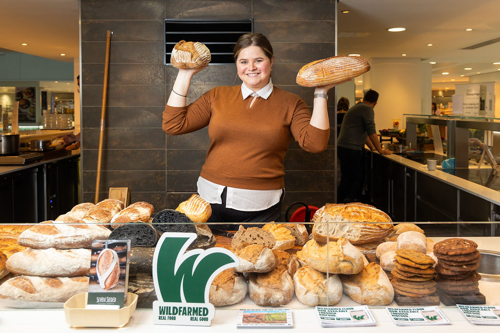 woman holding bread loaves