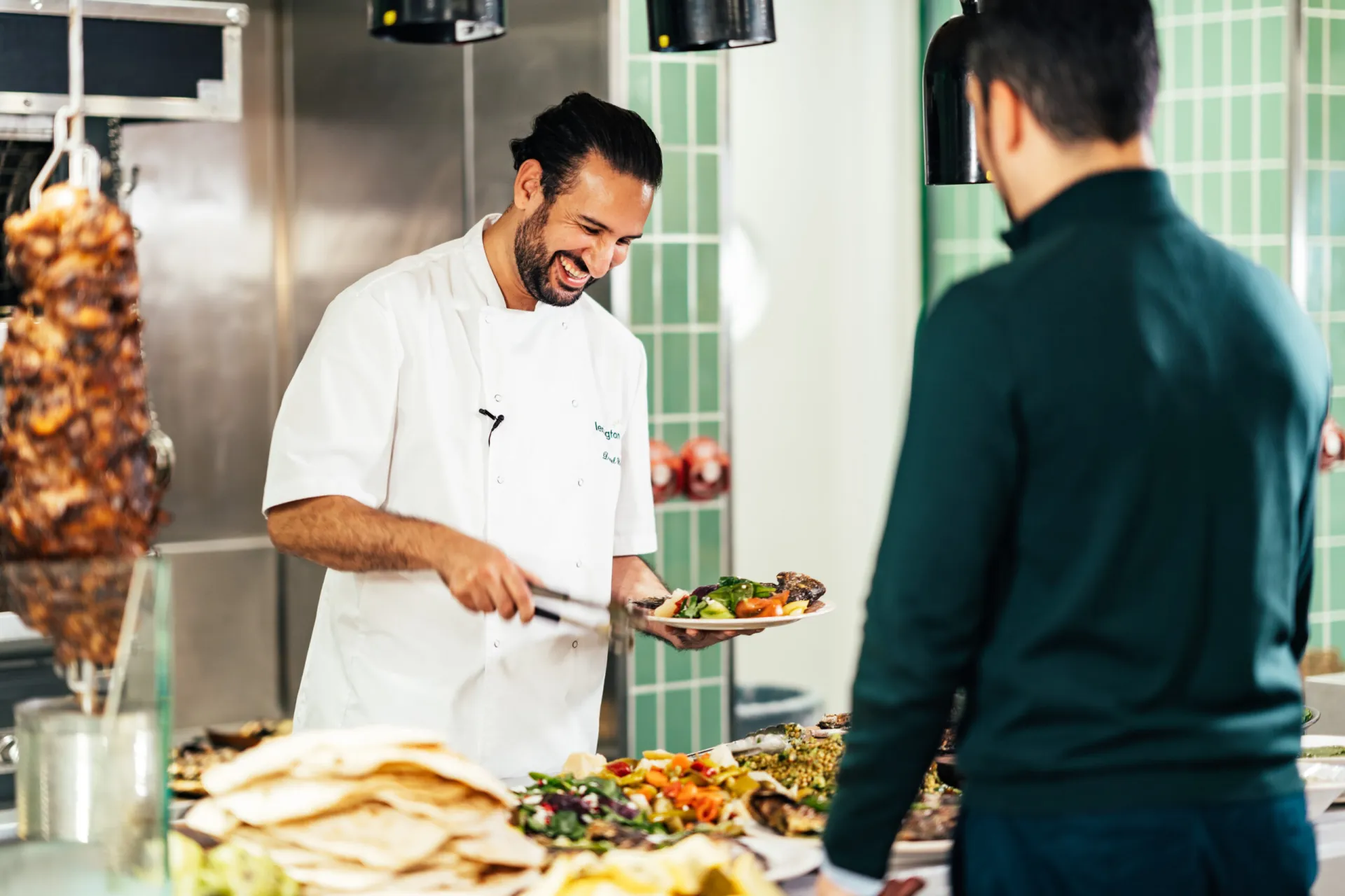 Chef smiling and serving food