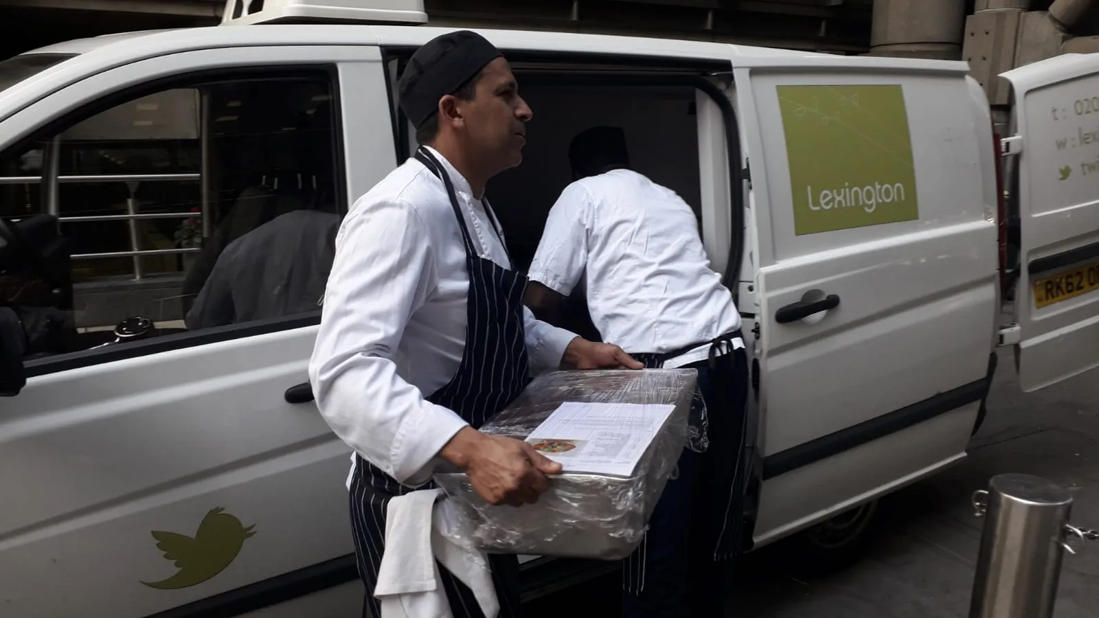 man unloading food crate
