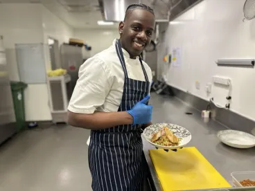 Prince holding a food plate