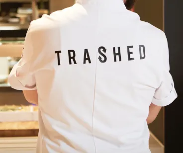 Chef outfit with "Trashed" written on the back