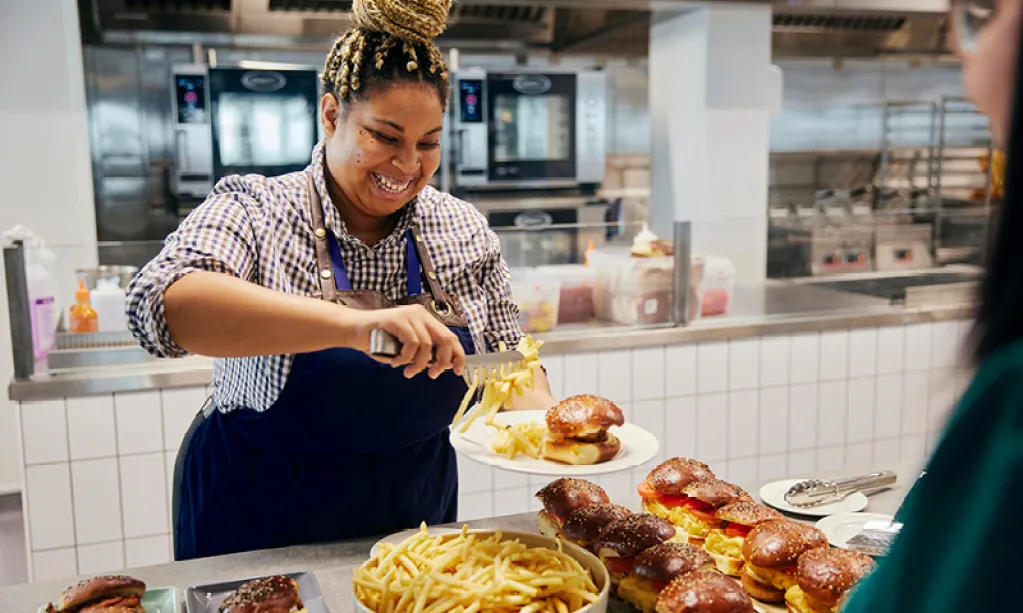 smiling woman serving food