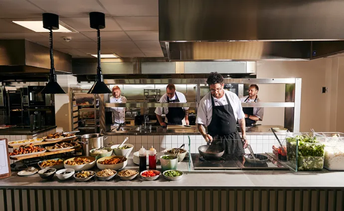 chefs cooking at site